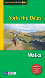 Image shows a walker on typical Yorkshire Dales walled green lane